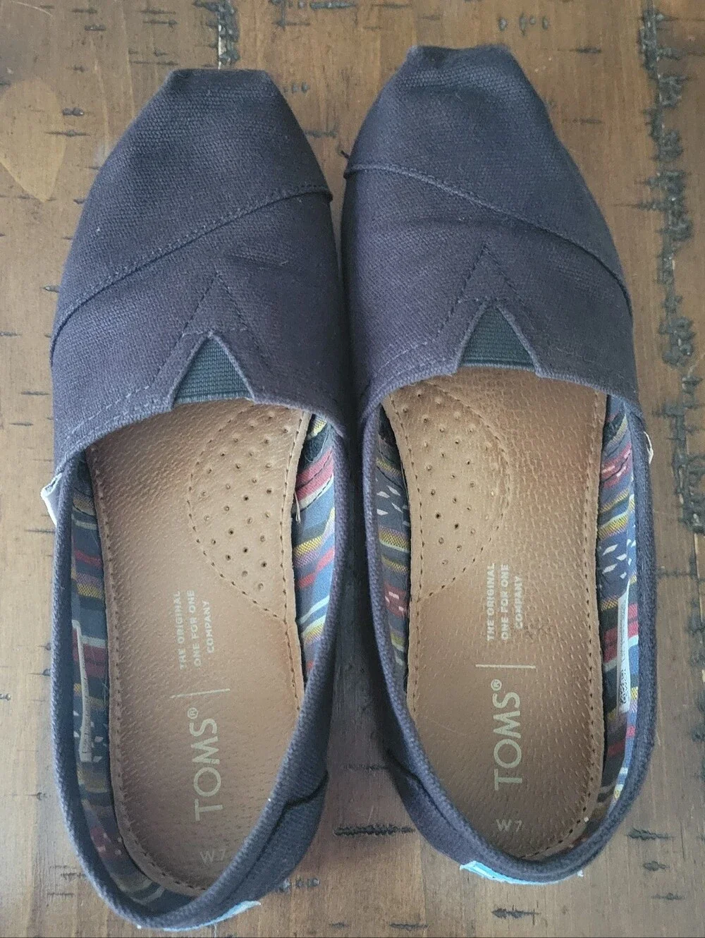 Toms Women's Canvas Slip-On Flats in Black with Multicolor Lining